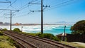 Electric Railway line on the shoreline of coastal town of Muizenberg