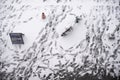 Electric rental bike in the snow surrounded by footprints