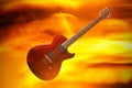 Electric rock guitar on a fire background. Royalty Free Stock Photo
