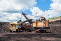 Electric rope shovels loading of coal, ore on the dump truck. Th