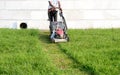 An Electric Rotary lawn mower machine mower, grass cutter or lawnmower for Mower, Cutting lawn areas. Motor powered lawn mower