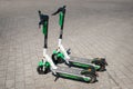 Electric scooter , escooter or e-scooter of the ride sharing company LIME on sidewalk Royalty Free Stock Photo