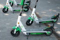 Electric scooter , escooter or e-scooter of the ride sharing company LIME on sidewalk Royalty Free Stock Photo