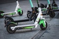 Electric scooter , escooter or e-scooter of the ride sharing company LIME and TIER on sidewalk Royalty Free Stock Photo