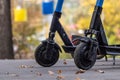 Electric Scooters in autumn park with cableway