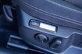 Electric seat massage button in a car, close-up