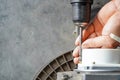 electric servo motor,Repairman using cordless screwdriver removing servo electric motor in workshop