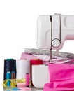 Electric sewing machine, cloth and accessories on grey