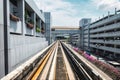 Electric skytrain airport link for passenger arrival to the next airport with running through the outside and parking building Royalty Free Stock Photo