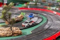 Electric slot cars on toy race track Royalty Free Stock Photo