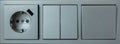 Electric socket and light switch panel, gray silver color Royalty Free Stock Photo