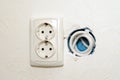 Electric sockets in the kitchen wall mounting hole TV socket. Royalty Free Stock Photo