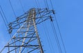 Electric station for supplying electricity to city, village. High voltage electric tower. Close-up. Power line against blue sky Royalty Free Stock Photo