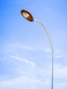 Electric street lamp on blue sky