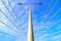 Electric street light pole over blue sky