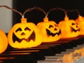 Electric string Halloween pumpkin lights on piano keyboard for Halloween party Royalty Free Stock Photo