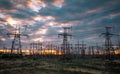 Electric substation with power lines and transformers, at sunset. Royalty Free Stock Photo