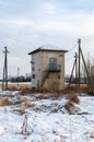 An electric substation in the village at winter Royalty Free Stock Photo