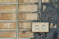 Electric switch on grunge dirty wall. Royalty Free Stock Photo