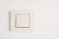 Electric switch with space for text on white wall. Royalty Free Stock Photo