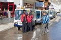Electric taxi drivers talk at the parking lot in Zermatt, Switzerland.