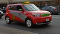 Electric taxicab, red Royalty Free Stock Photo