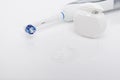 Electric Toothbrush and Dental Floss on White Royalty Free Stock Photo