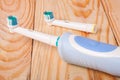 Electric Toothbrush on a light wooden background Royalty Free Stock Photo