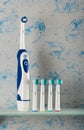 Electric toothbrush and replaceable nozzles of different colors Royalty Free Stock Photo