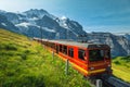 Electric tourist cogwheel train on the slope in Switzerland