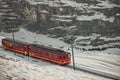 Electric tourist train and Eiger North face, Bernese Oberland, Switzerland.