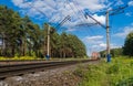 Electric train goes by rail, summer, countryside Royalty Free Stock Photo
