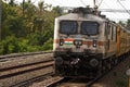 electric train moving through the indian railway track Royalty Free Stock Photo