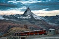 Electric train running on railway through Matterhorn mountain in Gornergrat station Royalty Free Stock Photo