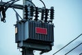Electric transformer on pole with blue sky Royalty Free Stock Photo