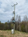 Electric transformers and wires installed on wooden column. Low voltage wires to supply power to the user Royalty Free Stock Photo