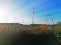 Electric transmission line. Power transmission pylon silhouette against blue sky at dusk. The concept of electrification