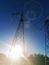 Electric transmission line. Power transmission pylon silhouette against blue sky at dusk. The concept of electrification Royalty Free Stock Photo