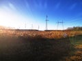 Electric transmission line. Power transmission pylon silhouette against blue sky at dusk. The concept of electrification Royalty Free Stock Photo