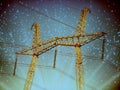 Electric transmission line. Power transmission pylon silhouette against blue sky at dusk. The concept of electrification Royalty Free Stock Photo