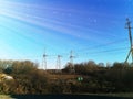 Electric transmission line. Power transmission pylon silhouette against blue sky at dusk. The concept of electrification Royalty Free Stock Photo