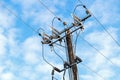 Electric transmission tower wooden electricity pylon blue background Royalty Free Stock Photo