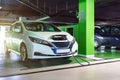 Electric transports. Electric car charge battery on eco energy charger station. Hybrid vehicle - green technology of future. Eco-