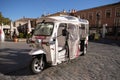 An electric tricycle vehicle for a guided city tour.