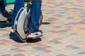 Electric unicycle. Man rides on mono wheel in park