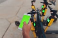 Electric urban transportation: the row of electric readies to ride scooter bikes with accumulators in the center of a