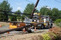 Electric utility repair crew on the scene of a broken wooden utility pole Royalty Free Stock Photo