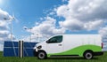 Electric van with charging station Royalty Free Stock Photo