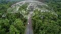 Electric vehicle car going through forest, EV electrical energy for environment, Nature power technology sustainable devlopment