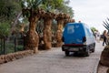 Electric vehicle garbage truck in Park Guell. Barcelona, Spain.